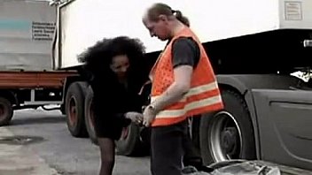 Black hooker riding on mature truck driver outside