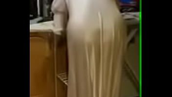 Wife in her satin nightie ironing