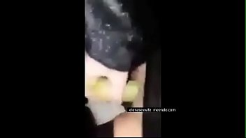 Masturbating with a banana in the outdoor