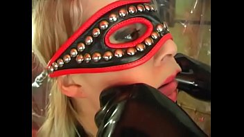 An unleashed slut in fetish dress ass fucked by a filth and aroused masked man