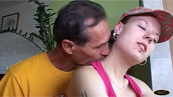 The older gentleman fucks the brunette girl while she does gymnastics on the exercise bike