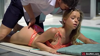 21SexNet&period;com - A guy joins his blonde friend on the side of the pool&period;He removes her top then fingers her ass&period;The teen blowjobs him then bends over for an anal sex&period;