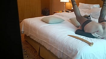 Milf plays with a new giant toy in a hotel room