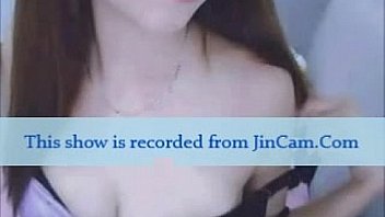 Asian babe masturbating whilte watching porn on webcam chat