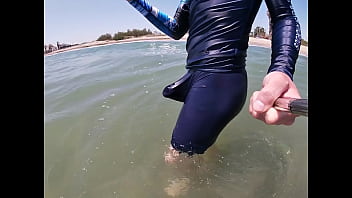 Surfer gets erect in his lycra for the pleasure of the people